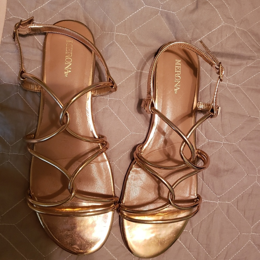 A pair of Gold strappy Sandals